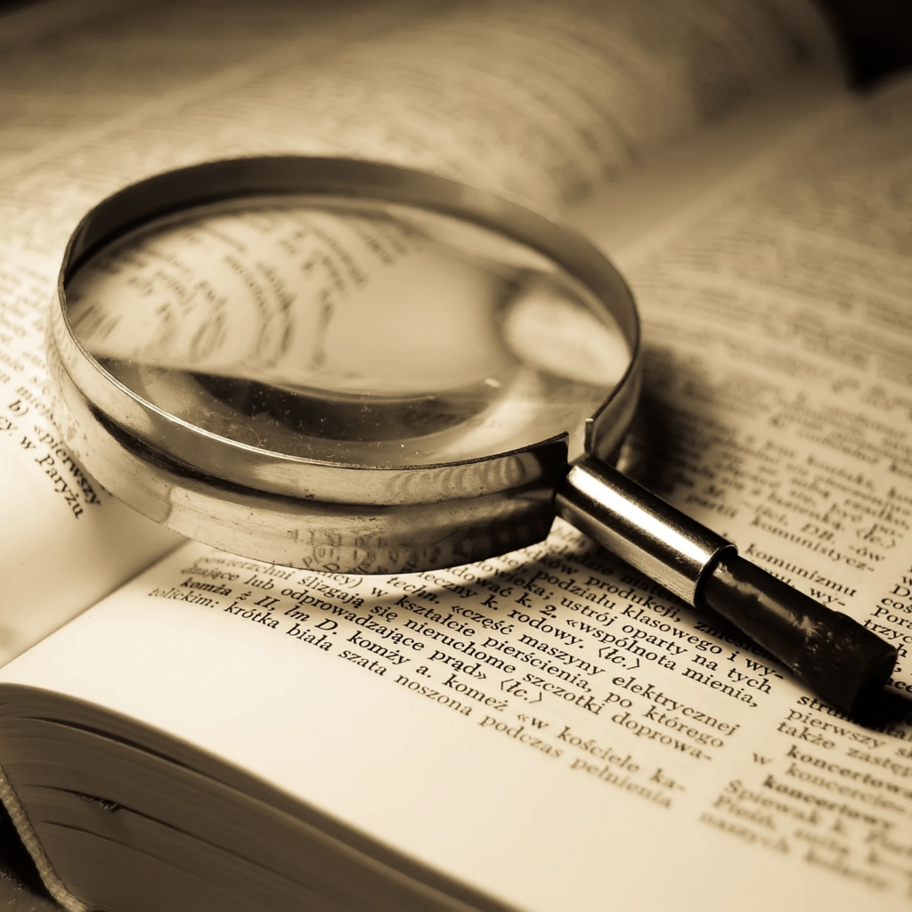 Dictionary and magnifying glass