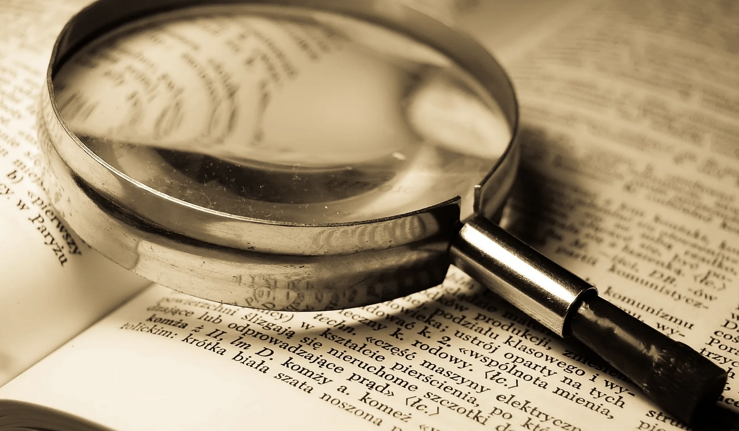 Dictionary and magnifying glass