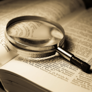 Magnifying glass lying on an open book